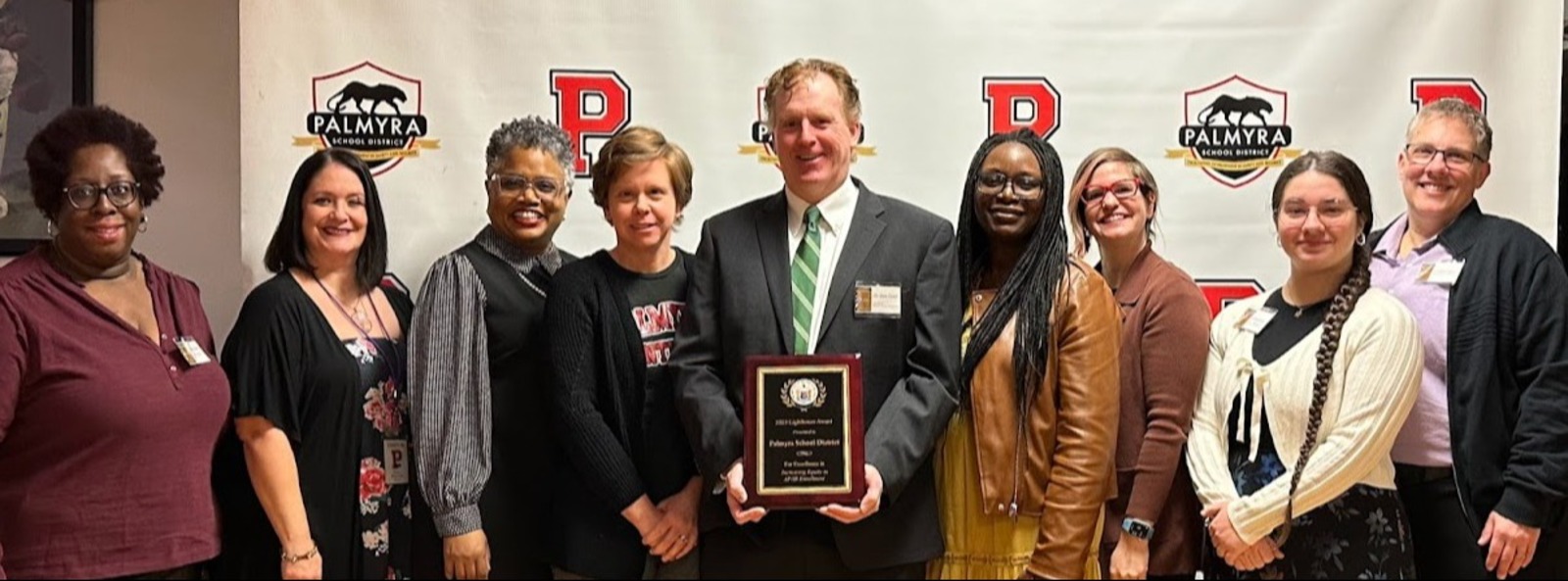 2024 Board of Education members with acting NJ DoE Commissioner accepting the Lighthouse Award