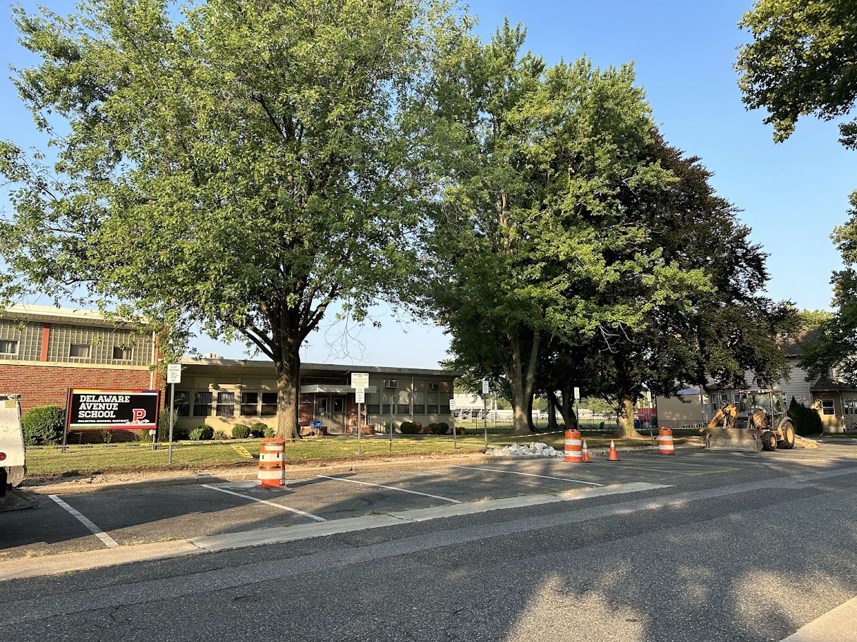 DAS sidewalks dug up near door 1 with construction vehicles