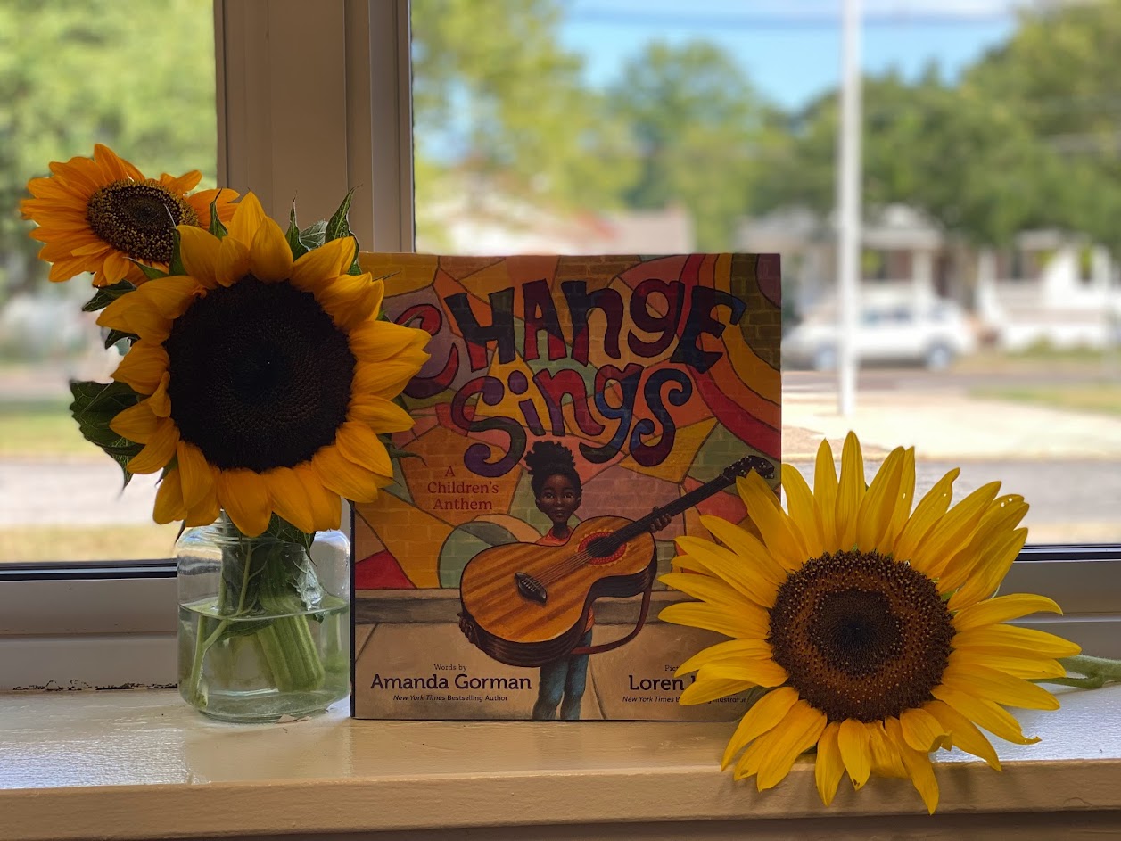 change sings throughout charles street school sunflowers