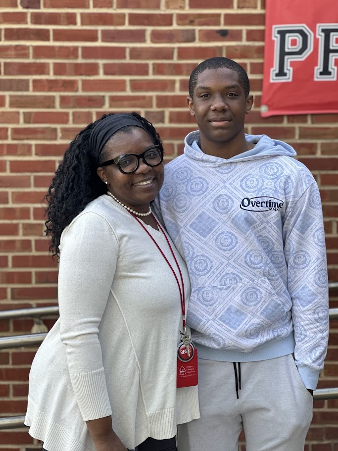 Mrs. Lee & her son outside of CSS