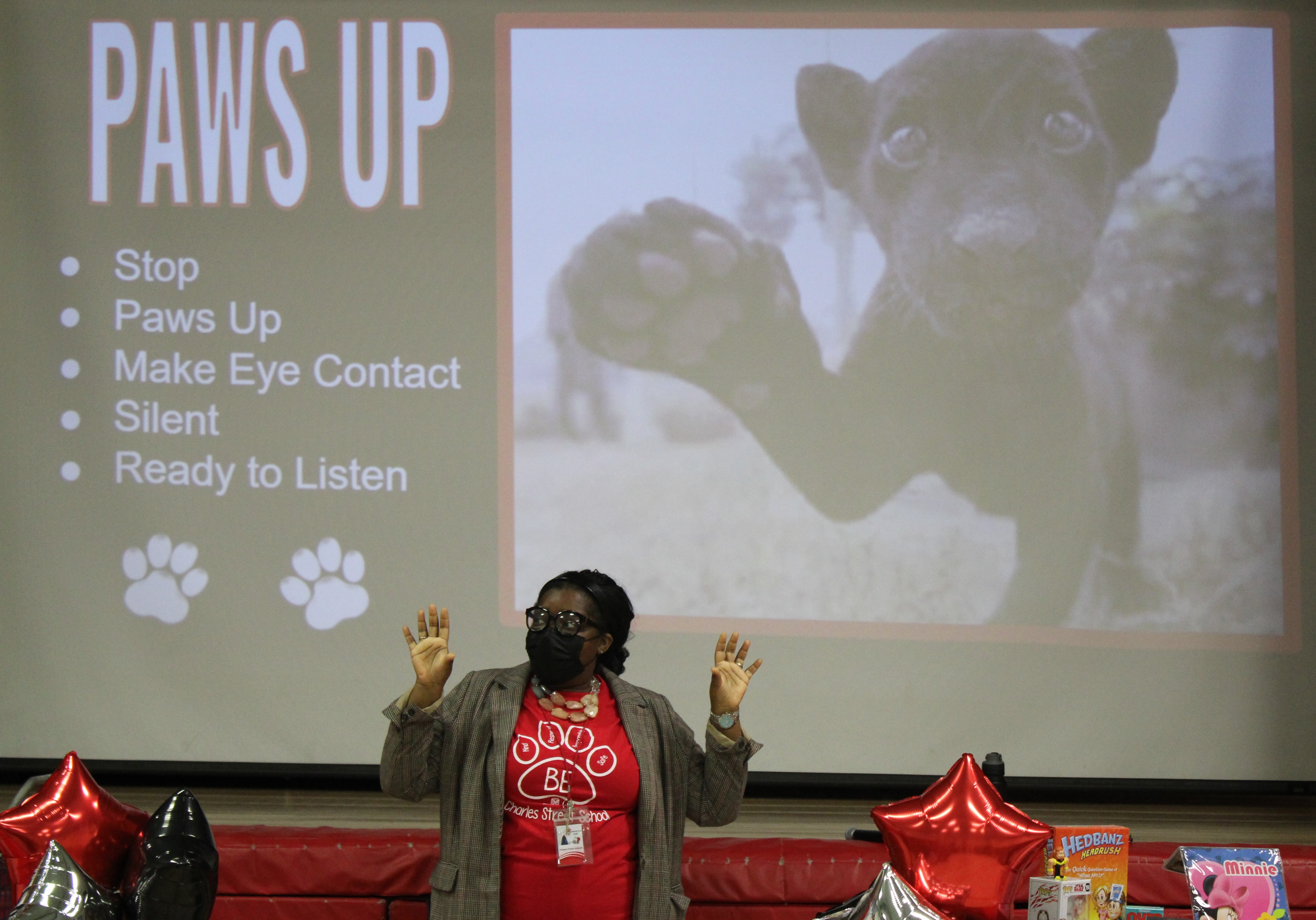 PRINCIPAL DEMONSTRATING PAWS UP