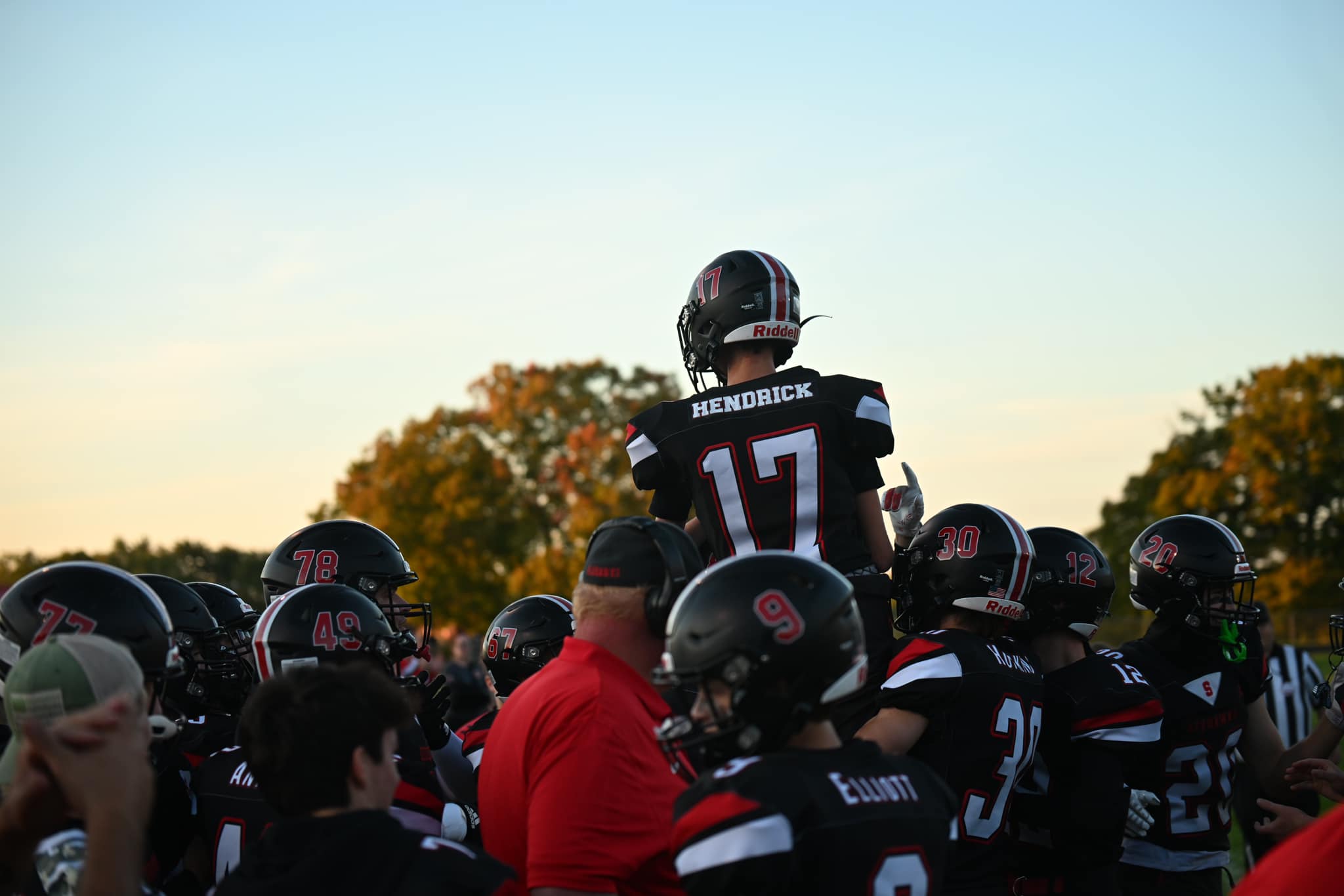 Hedrick lifted by football team