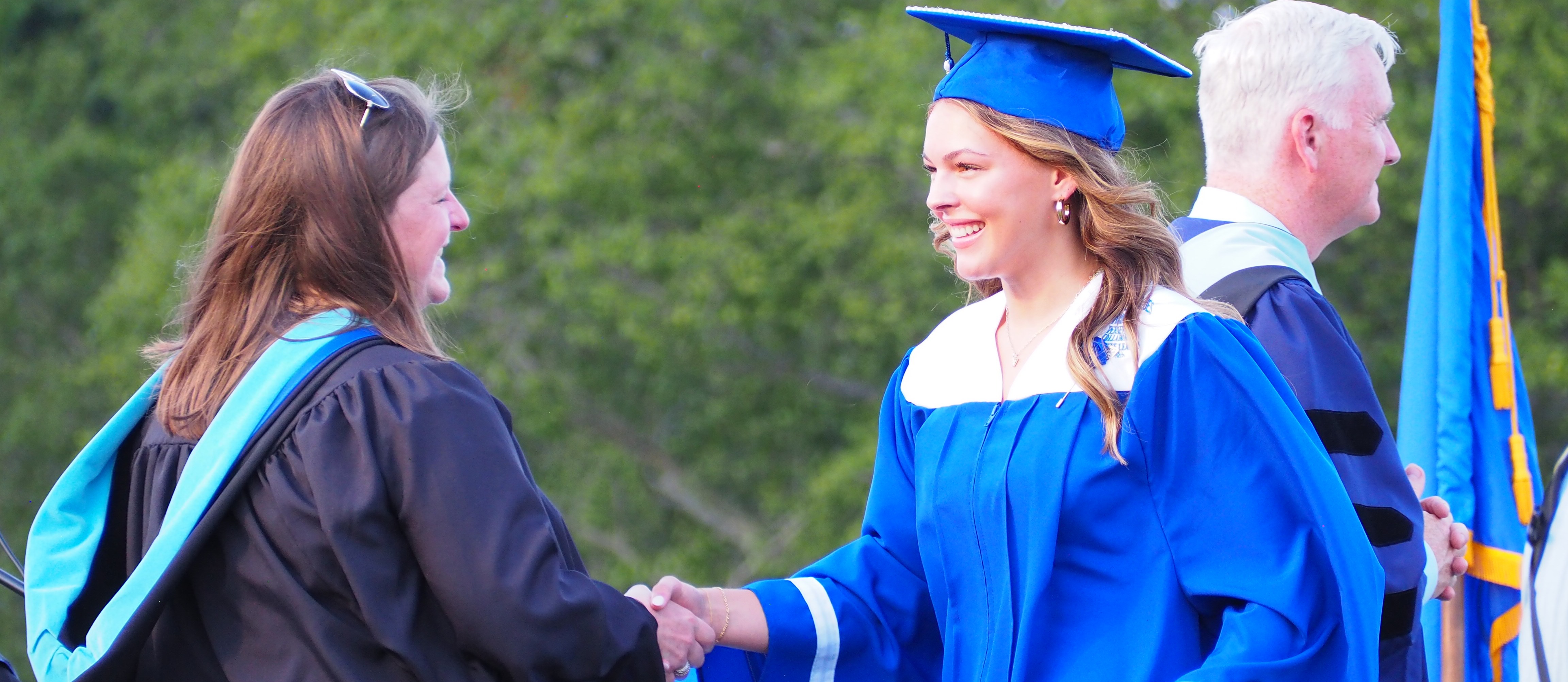 Graduate handshake