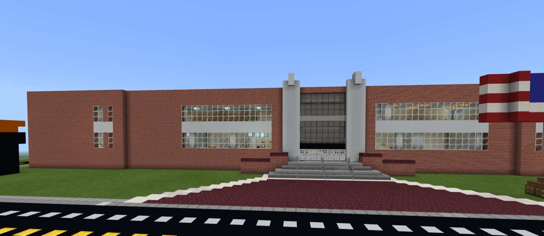 JMS: Minecraft created image of Jonesville Middle School with american flag out front