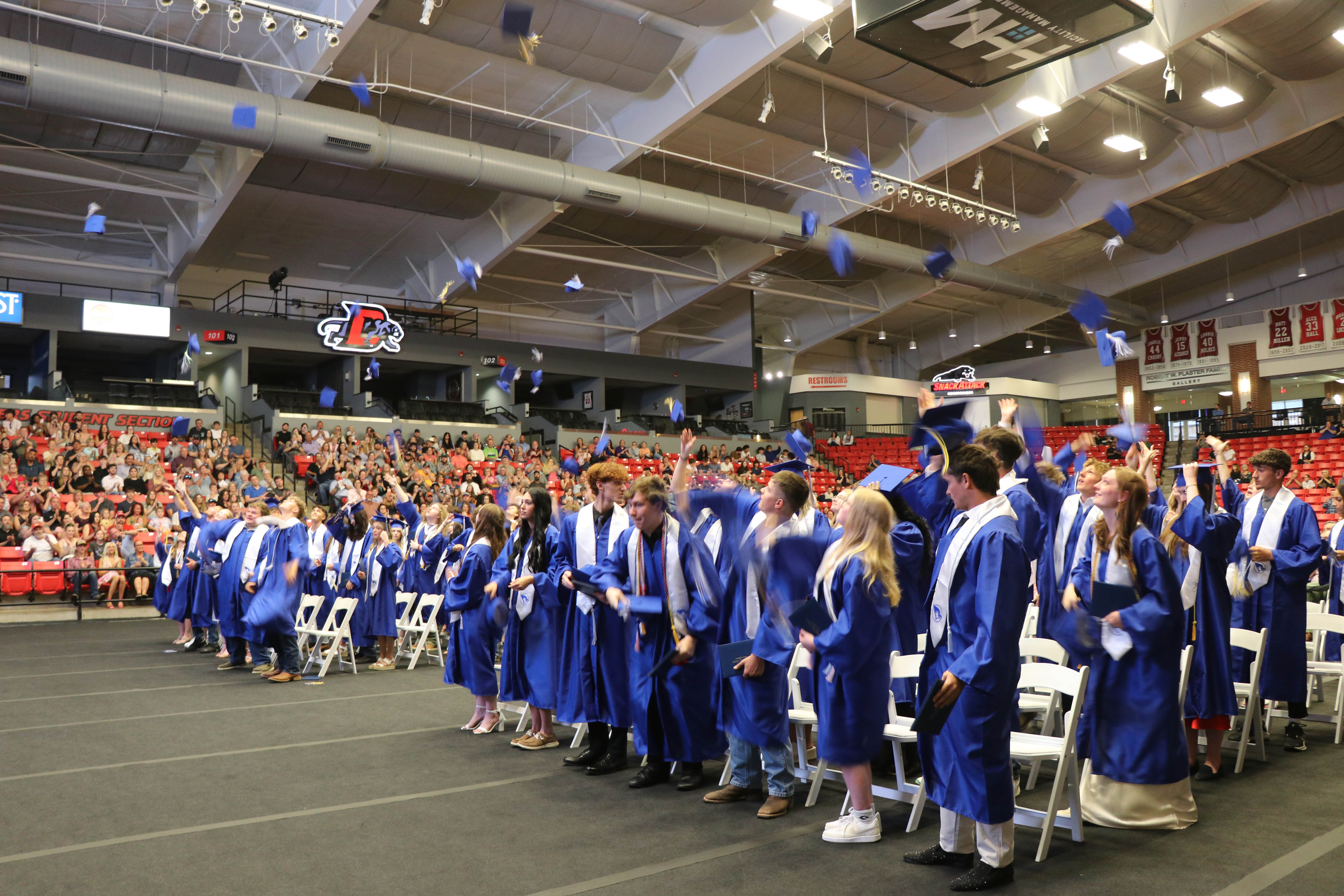 Graduates throwing caps