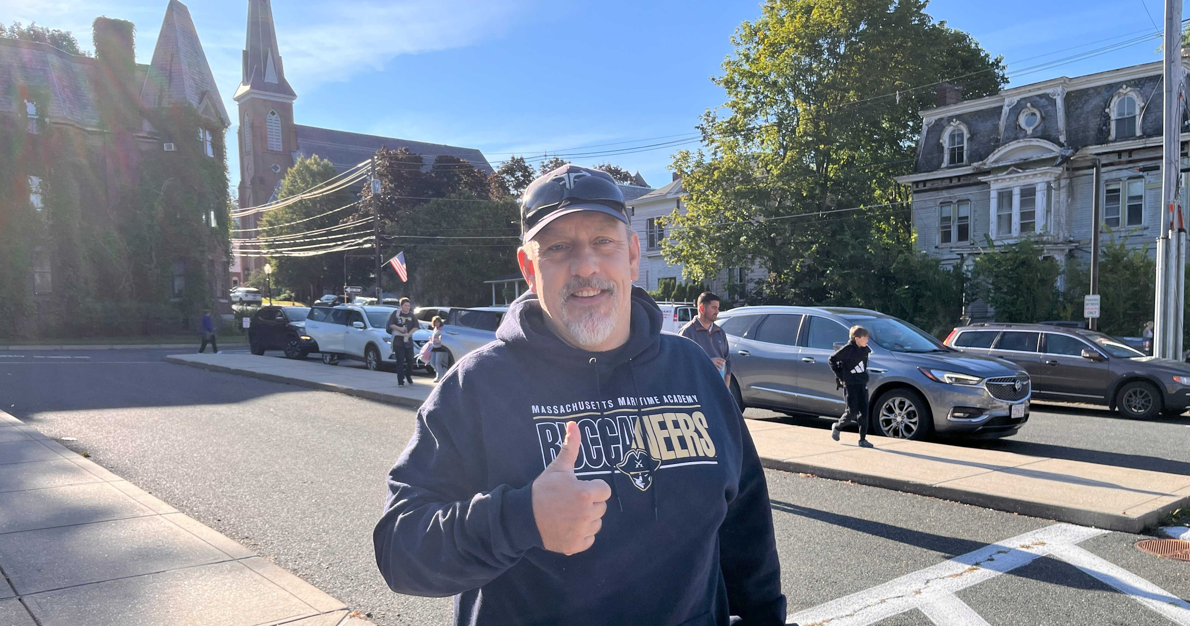 Coach Marceau giving a thumbs up  at arrival on the first day of school