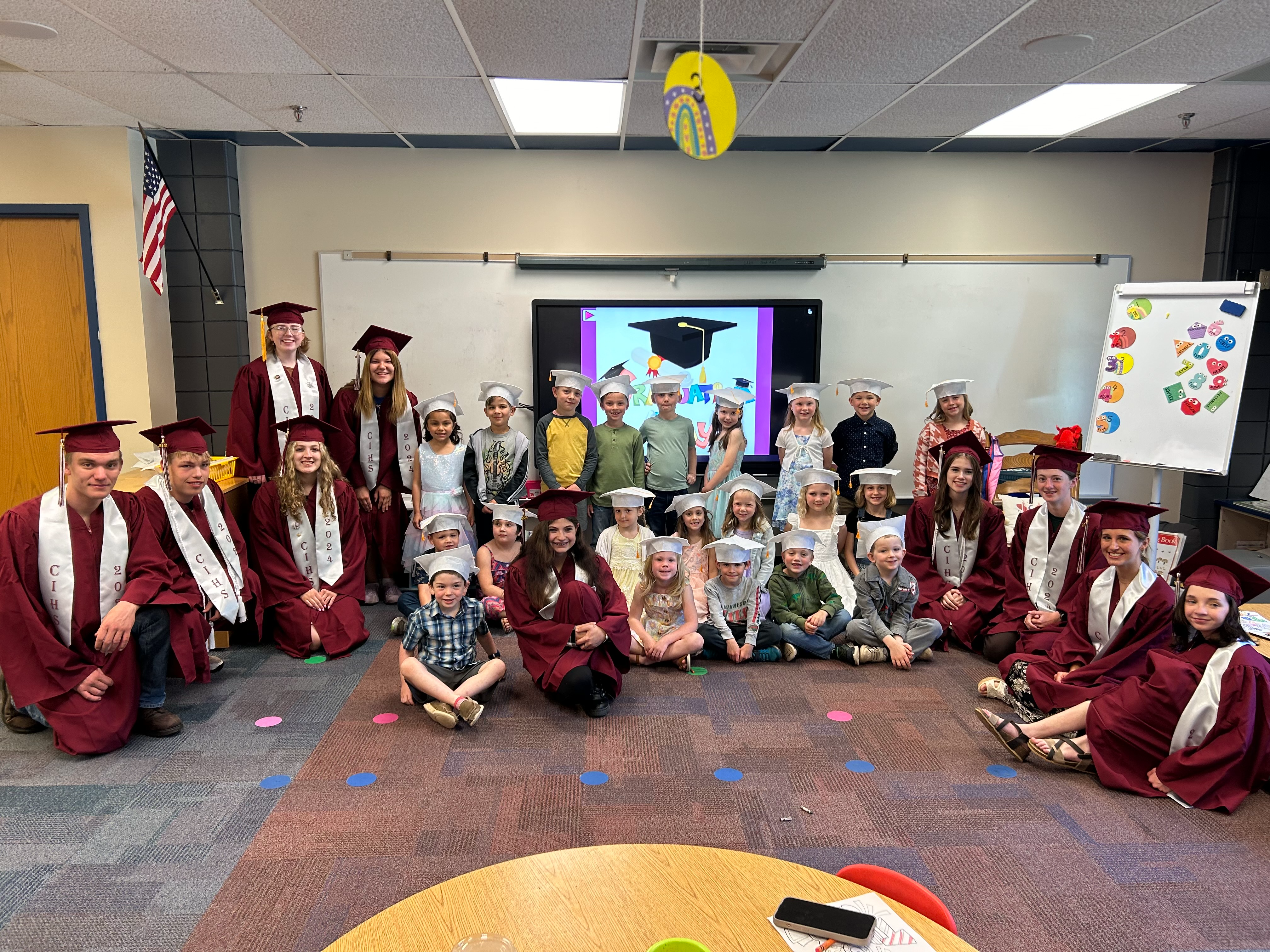 ci grads with kindergarten grads