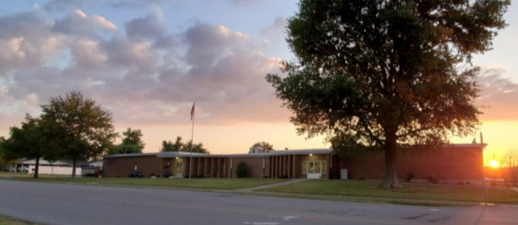 Outside of Wikey Elementary from Wallace Avenue at sunset