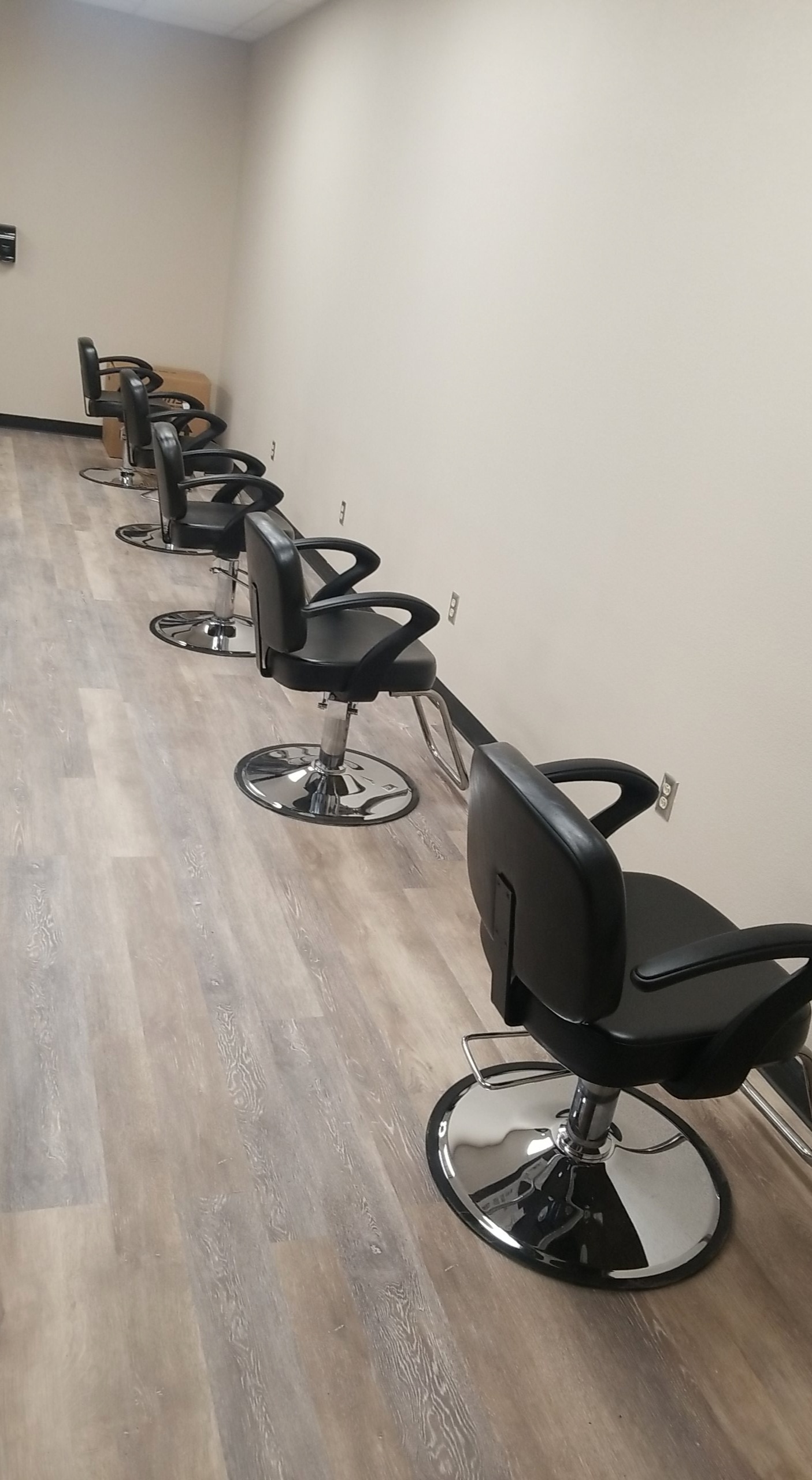 CTE Updates - 4 small black hair-styling chairs