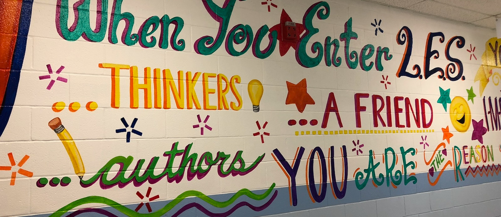 Mural wall - when you enter LES ... thinkers... a friend ...authors ... you are the reason