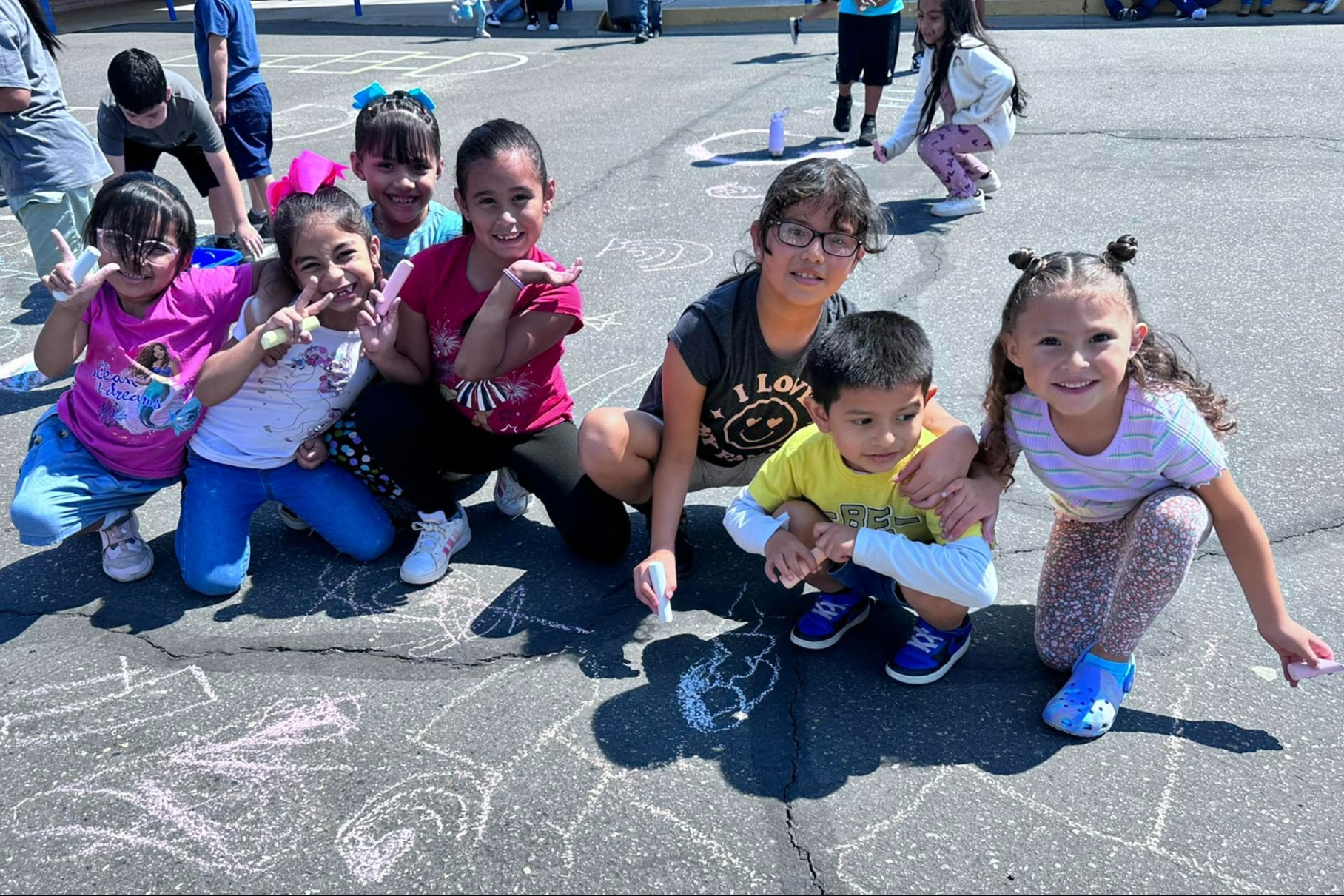 KCES Students on chalking on blacktop 