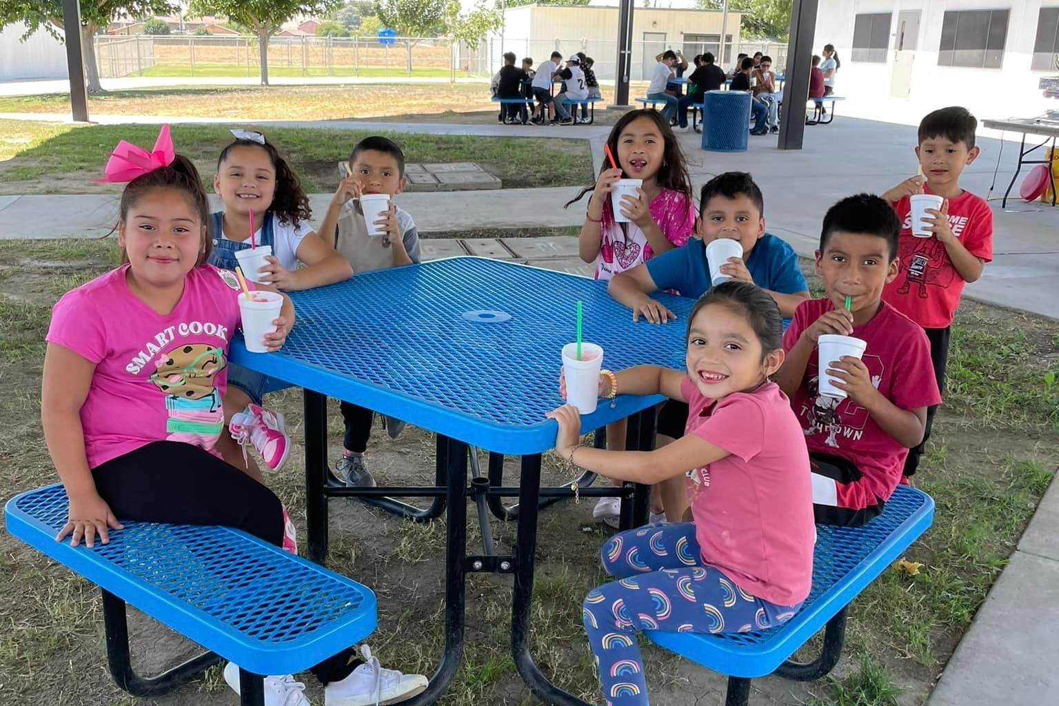 TES students sitting on table with ice cream
