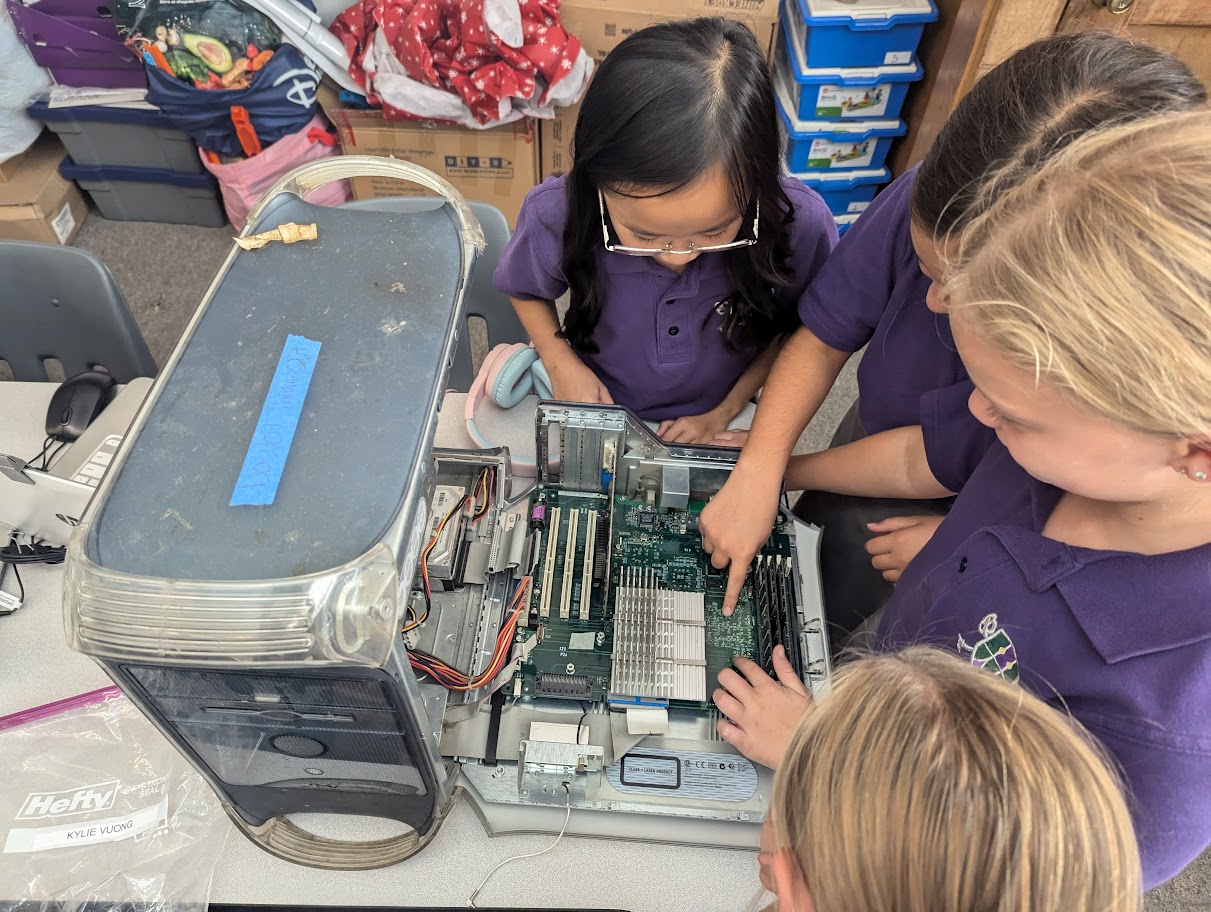 4th grade girls dissecting a computer