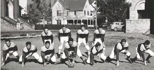 black and white photo of the football team from decades ago