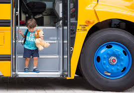 student getting off of bus