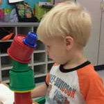 child stacking cups