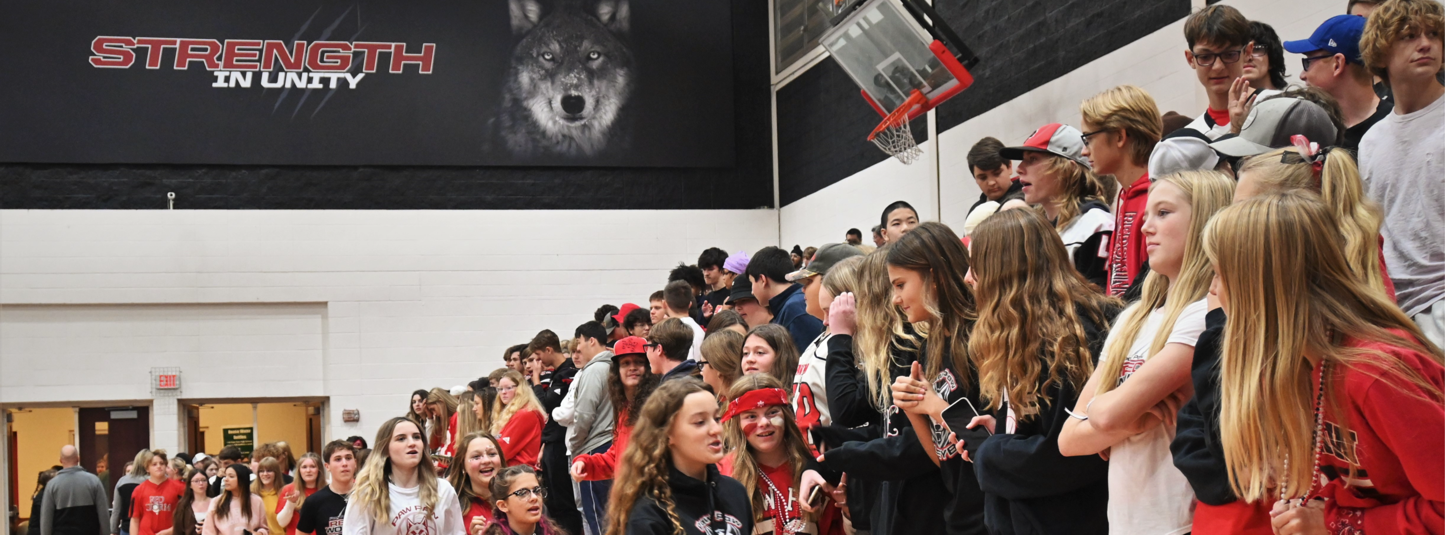 Students entering the High School gym during a pep rally.