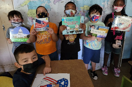 students holding books about september 11th