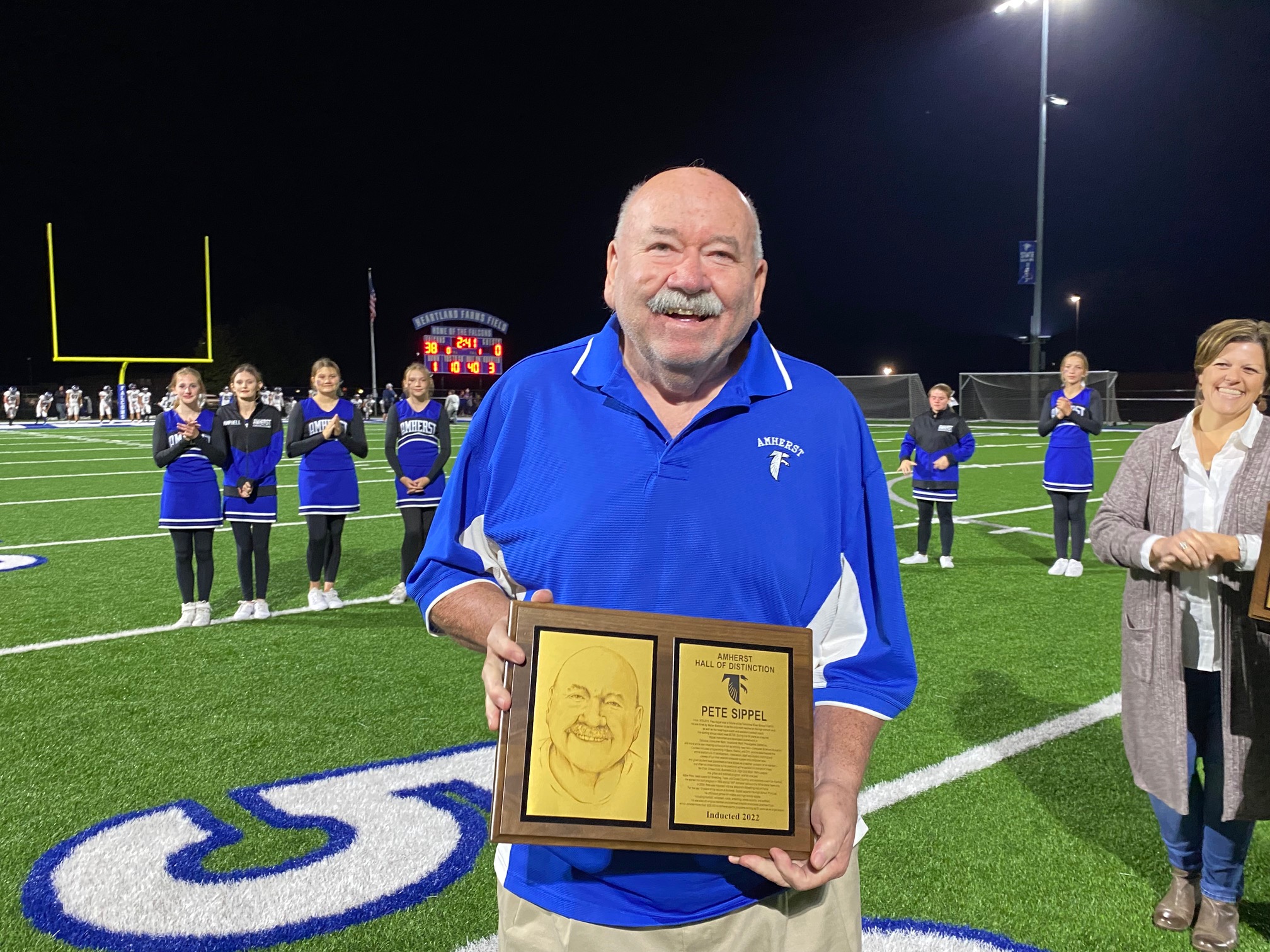 Pete Sippel accepting his award at AHS Homecoming 2022