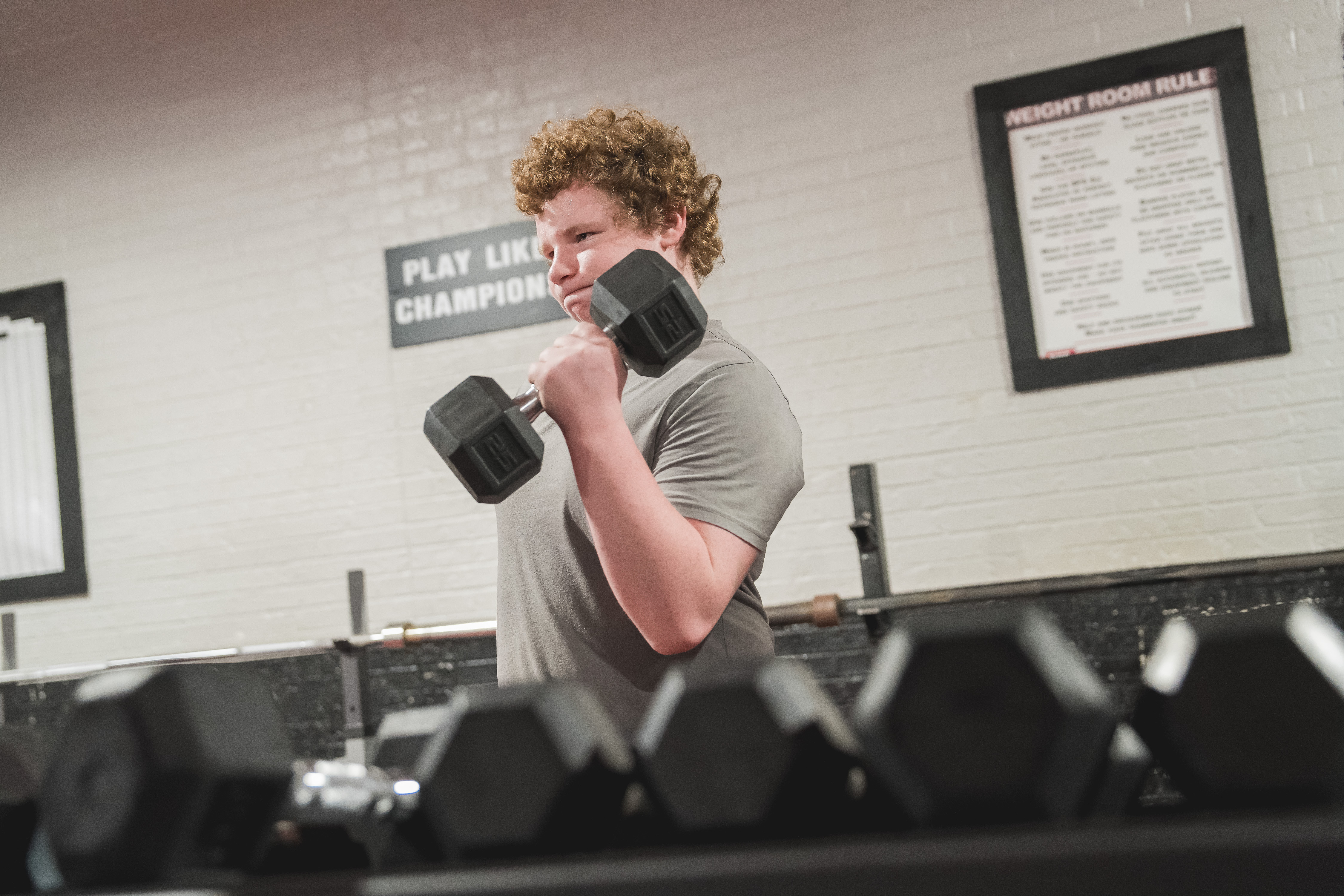 Reed City High School student using weights