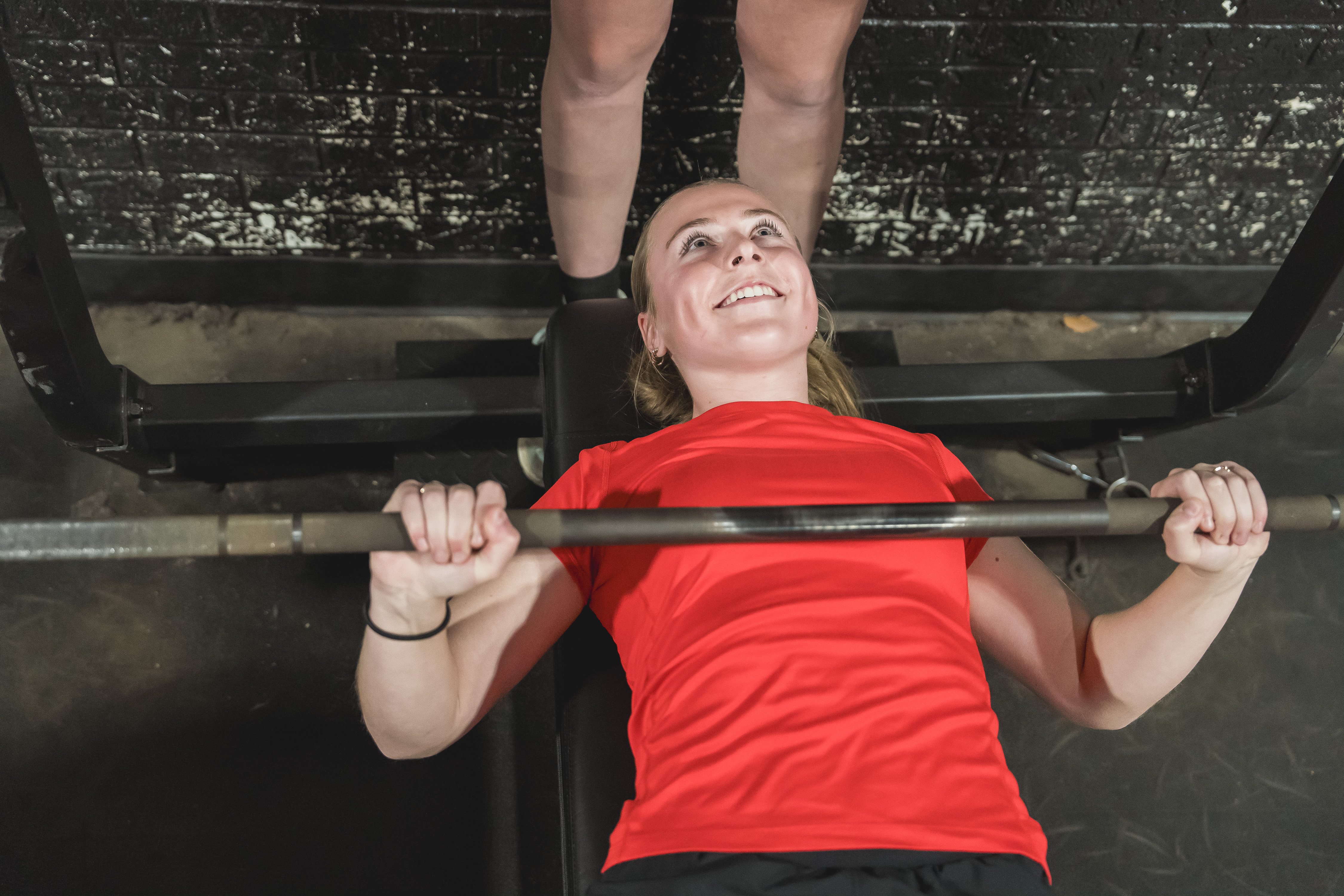 Reed City High School student on bench press