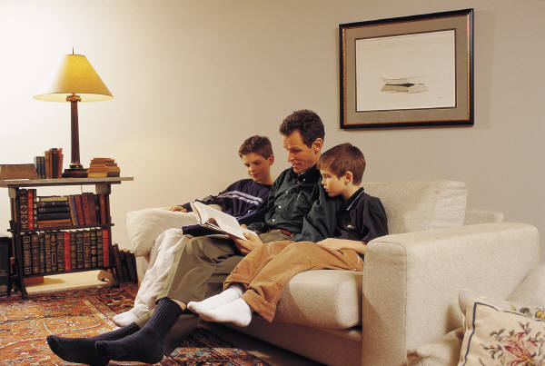Photo of a family reading.