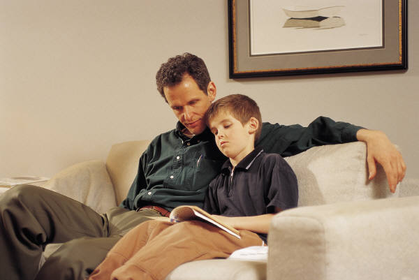 Photo of a kid with his dad.