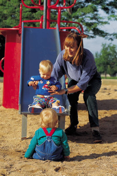 Photo of a mom playing with her kids.