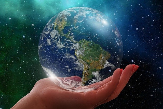 Image of a world on a hand.
