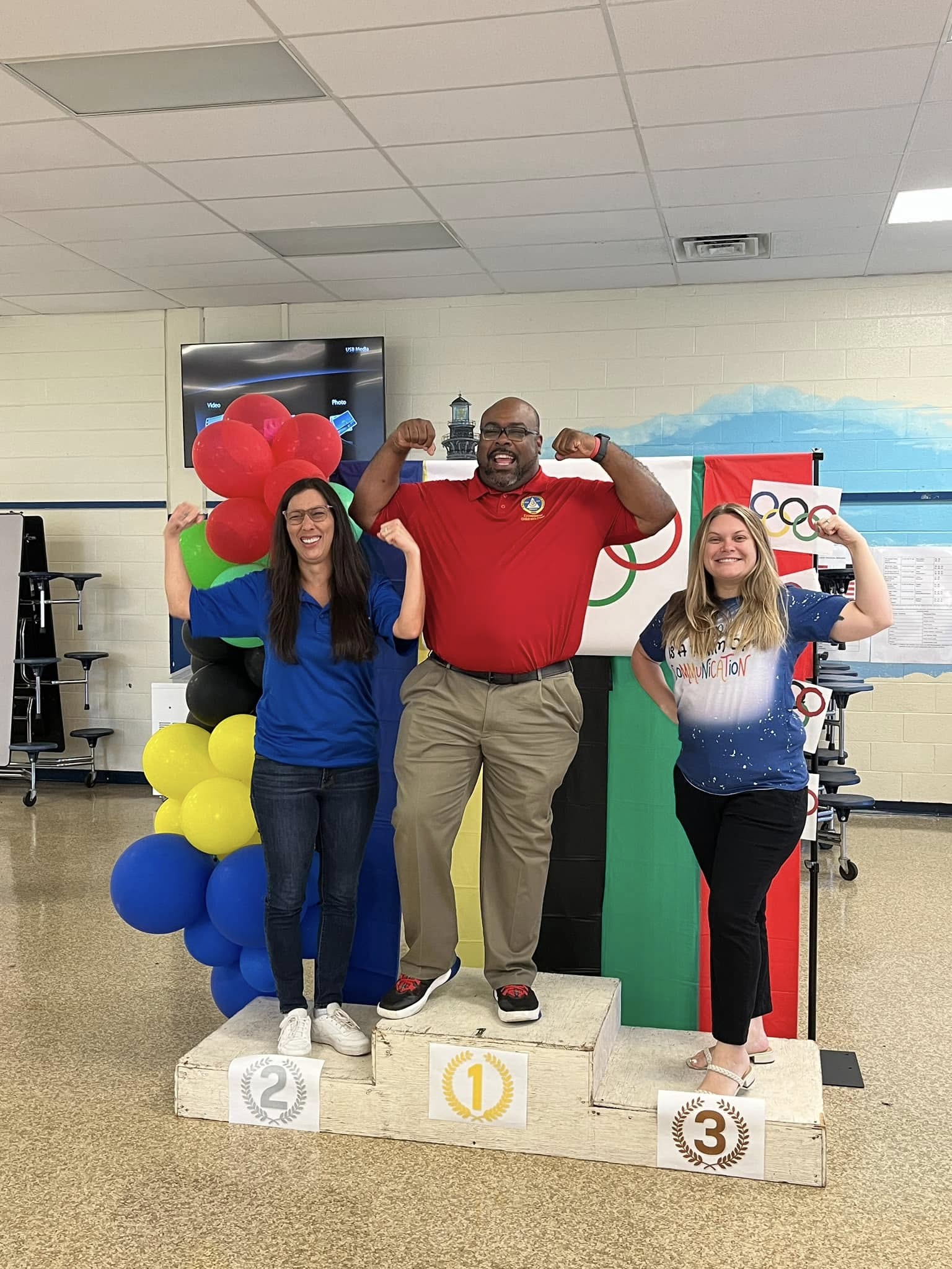 EC staff pose with Olympics theme