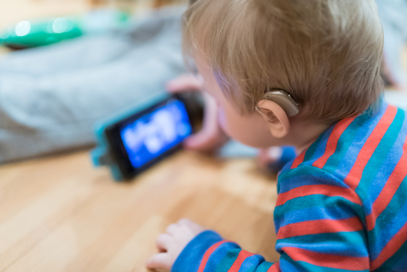 child with hearing aid