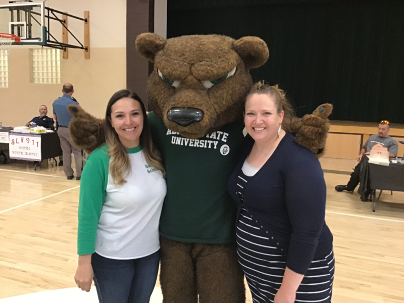 photo of teachers with the mascot