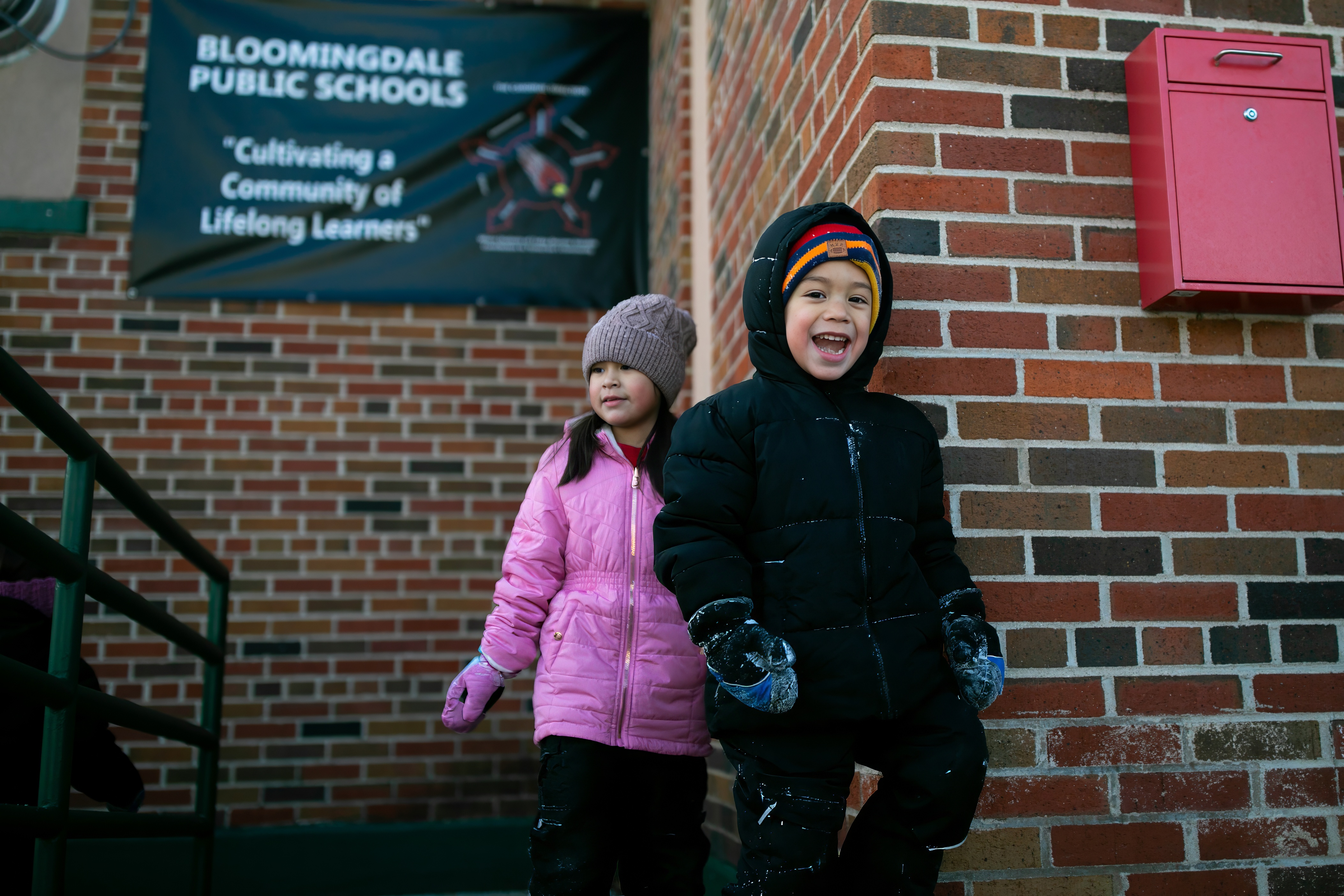 students walki ng out for recess in snow 