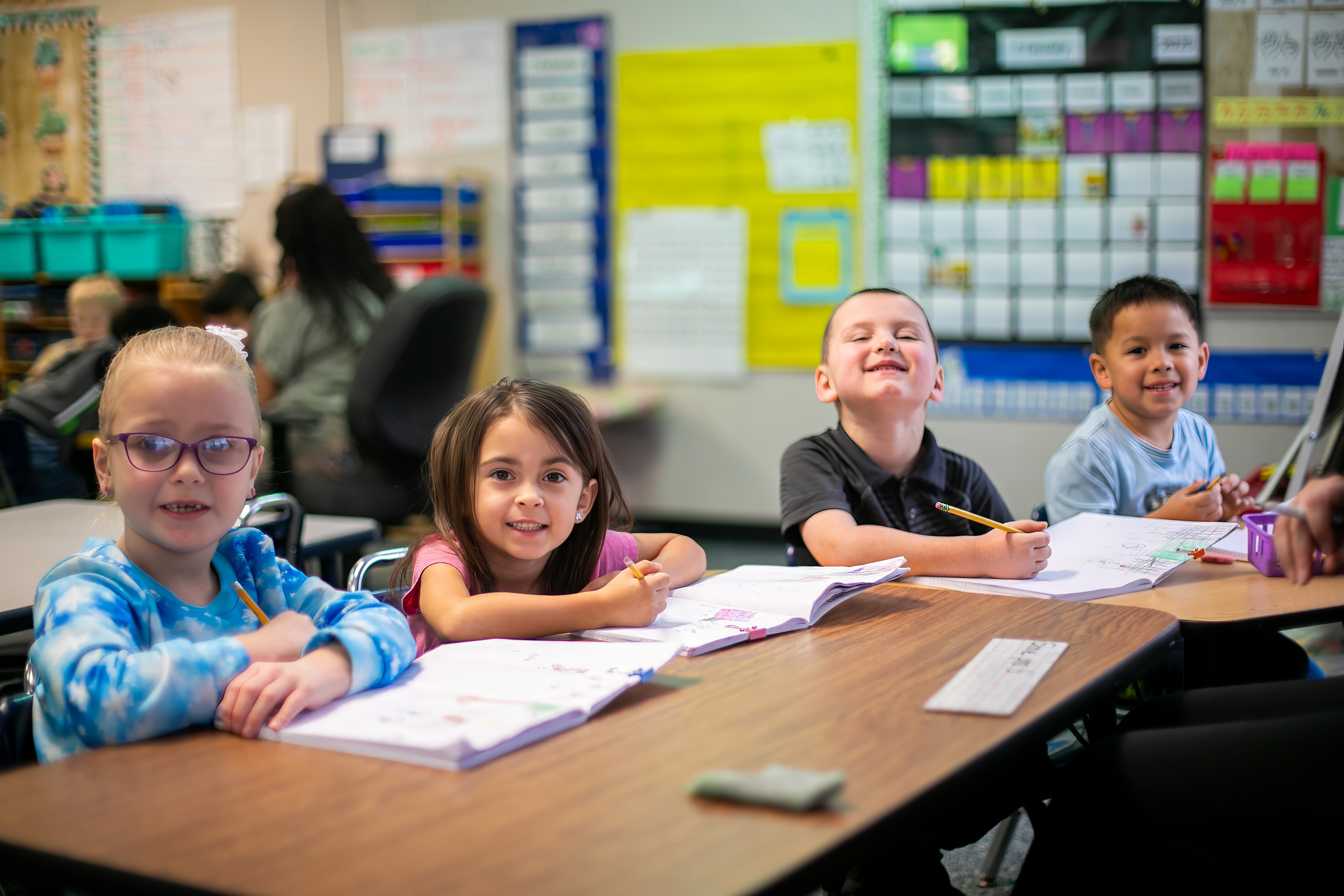 students learning and smiling in classroom 