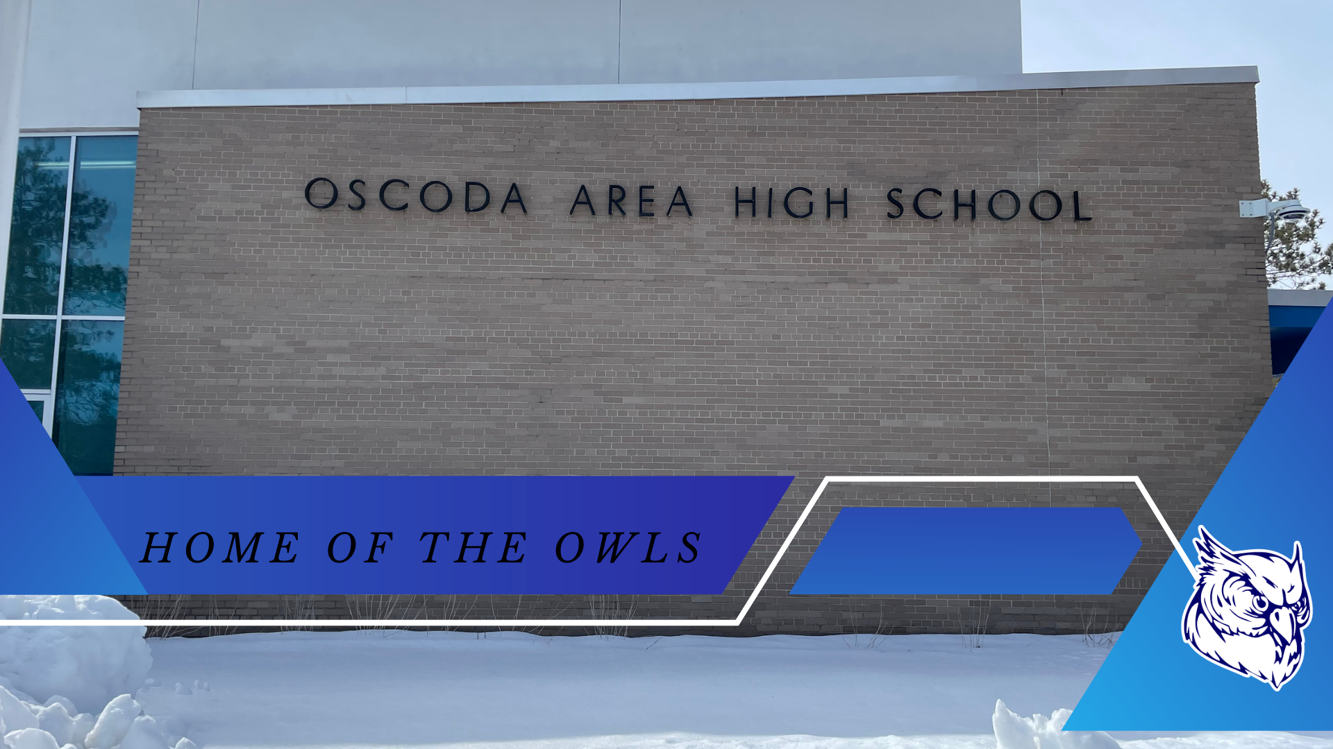 image of wall with text oscoda area high school home of the owls