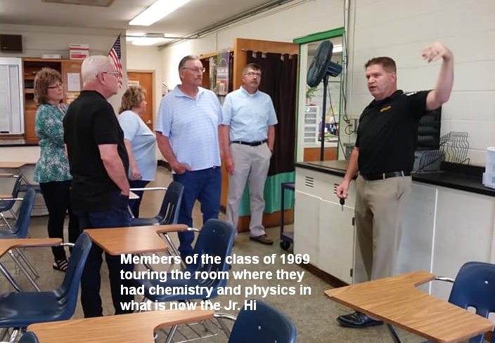 Members of the class of 1969 touring the room where they had chemistry and physics in what is now the Jr. High