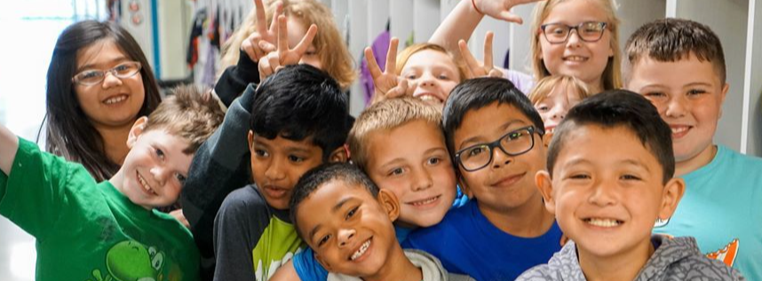 group of young children smiling at camera