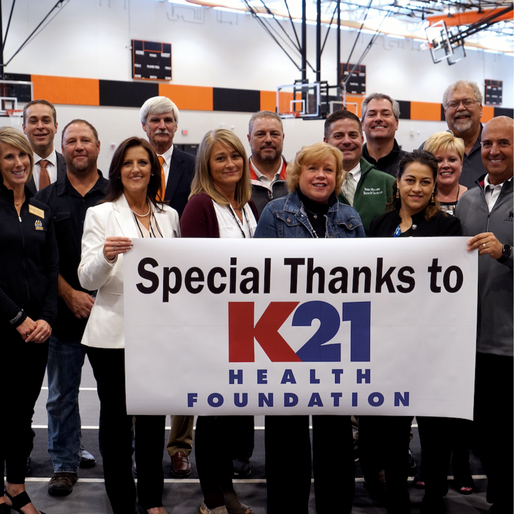 special thanks to k21 heatlh foundation banner being held up by team