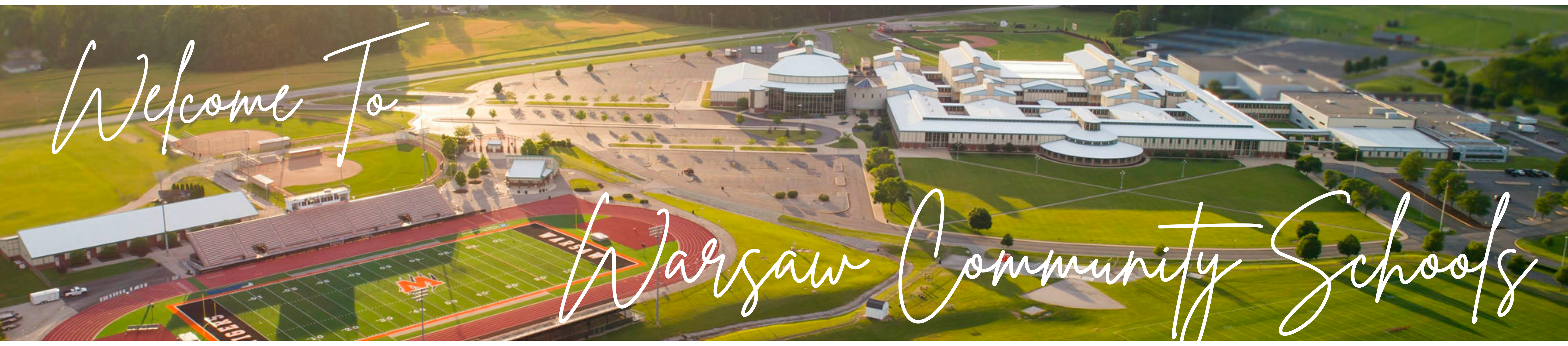 Welcome to Warsaw Community Schools. Aerial image of school campus