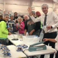 Staff and students volunteering in hair nets