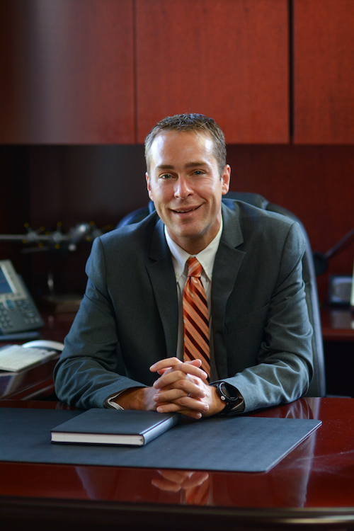 David Hoffert seated at his desk