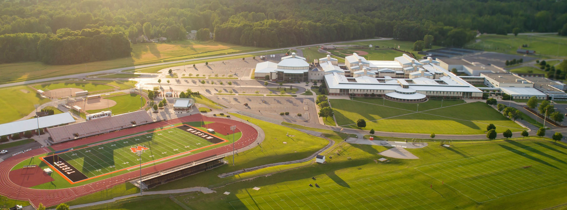 aerial view of high school campus and football field