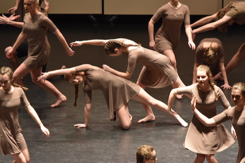 Dance students practice a lyrical choreography on stage
