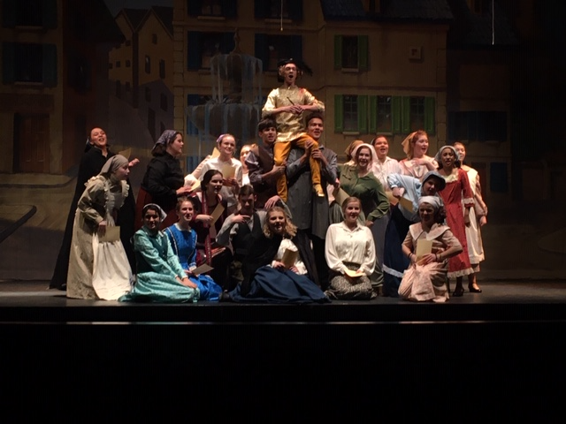 Theatre students posed together during a musical number on stage