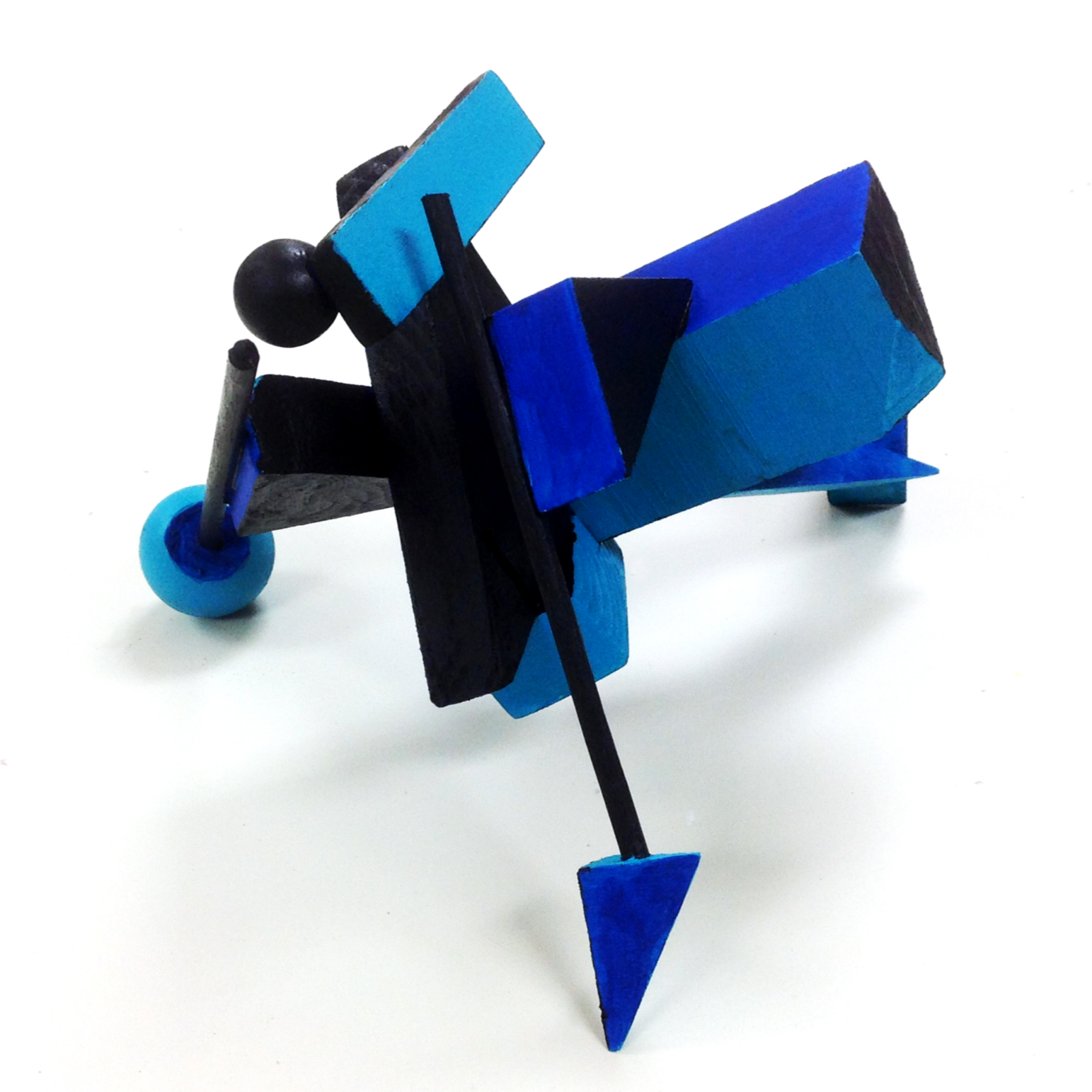 abstract sculpture made of blue and black wooden shapes