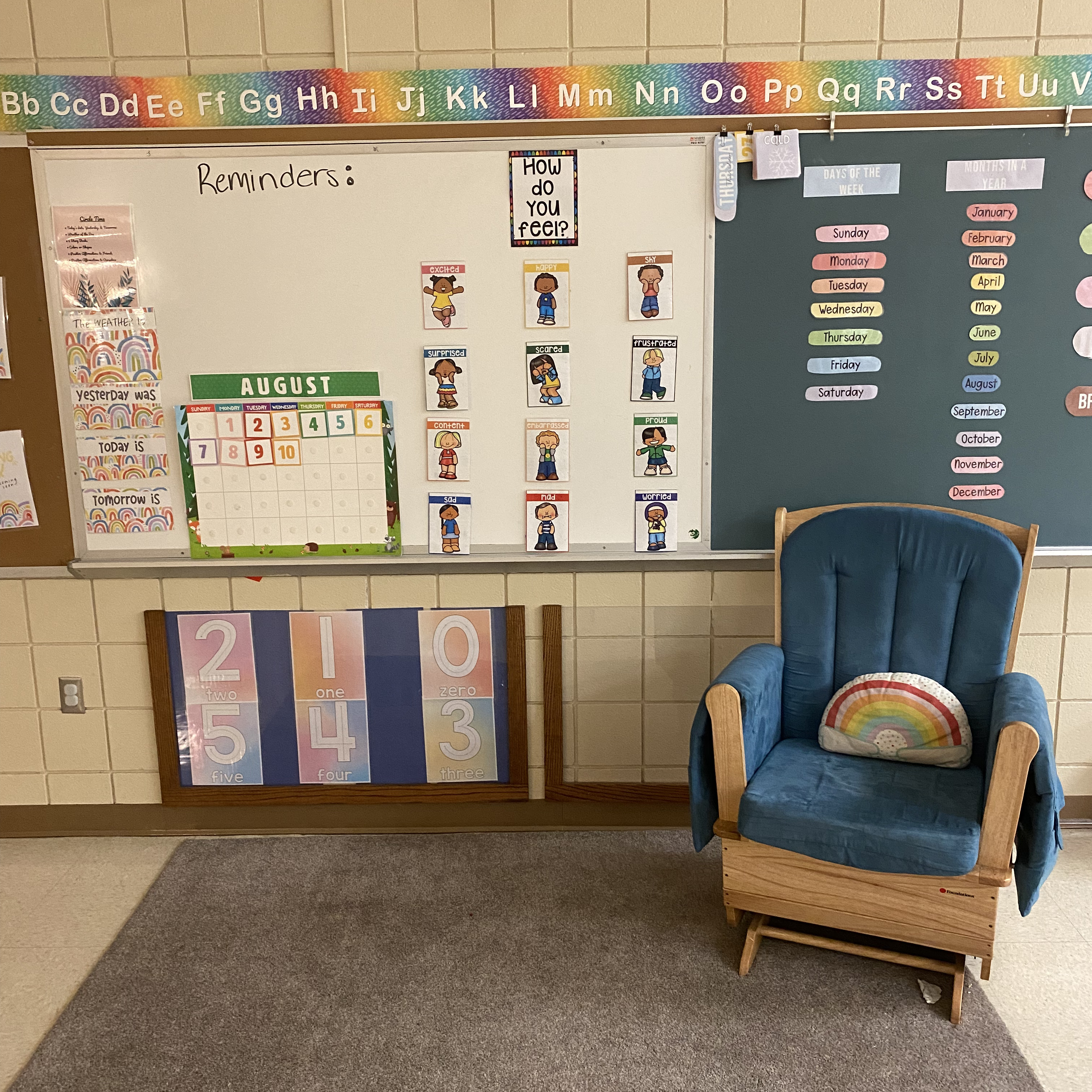 image of classroom white board with a rocking chair in front for story time