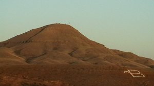 A photo of a brown mountain