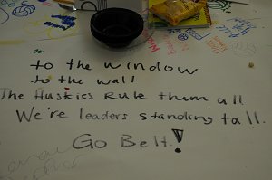 It's a written cheer saying "To the window, to the wall, The Huskies rule them all, We're leaders standing tall, Go Belt!"