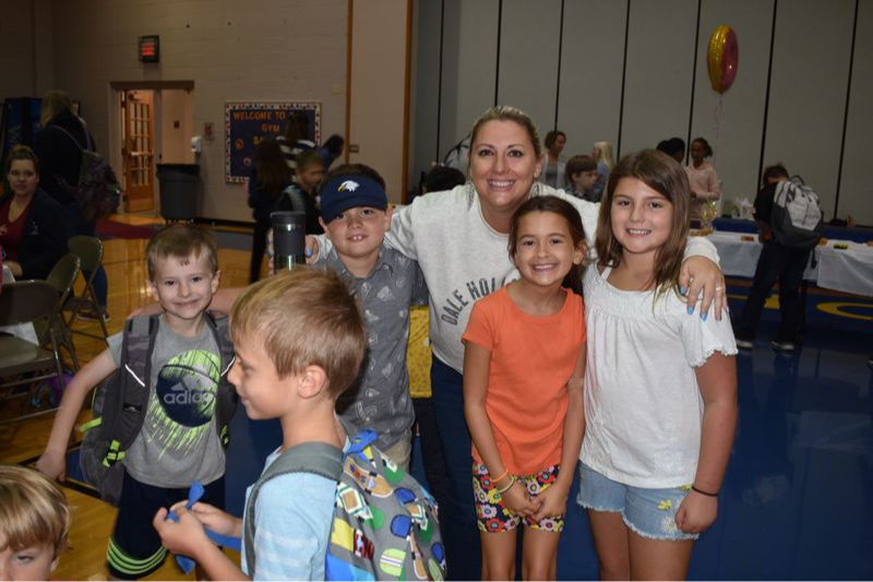 Eisenhower Students and teacher smiling for the camera