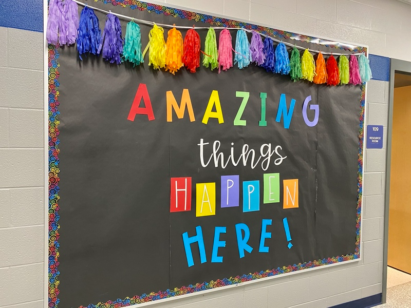 "Amazing Things Happen Here" poster board